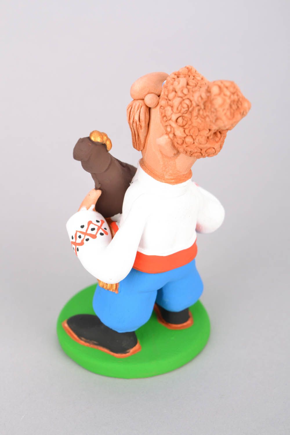 Keramik-Figur Kosak spielt Pfeife foto 5