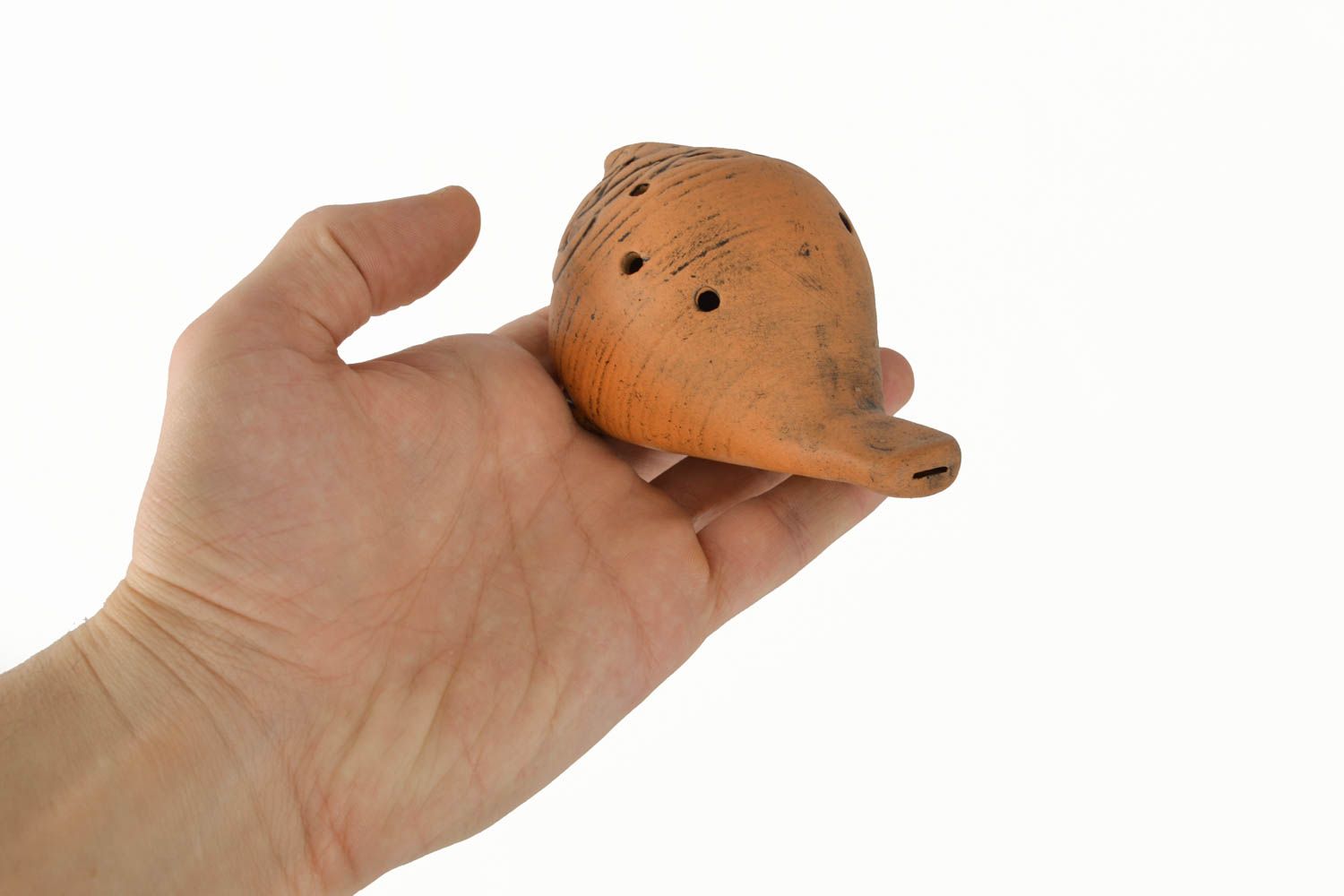 Silbato de arcilla con forma de juguete foto 4
