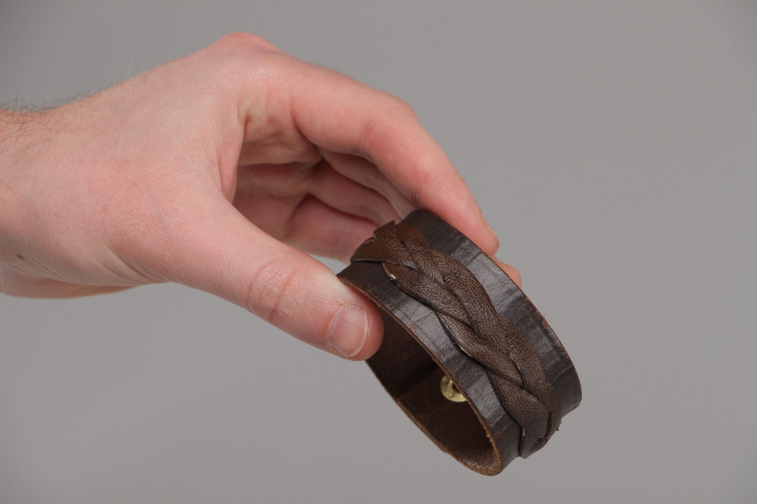 Handmade wrist bracelet woven of genuine brown leather with metal stud unisex photo 4