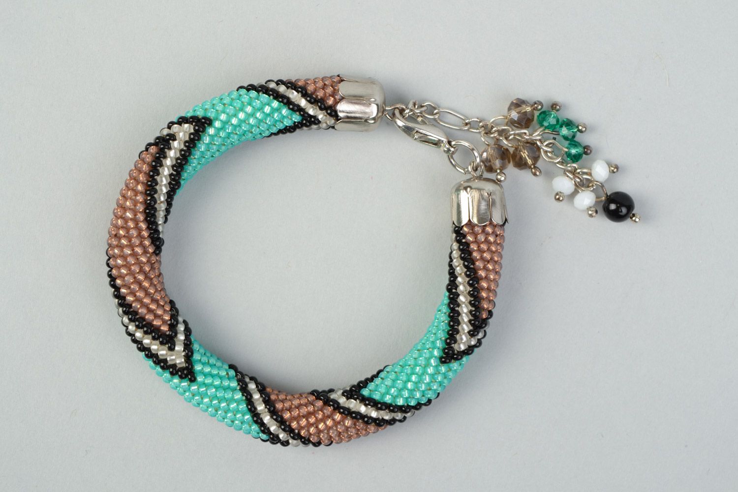 Stylish handmade beaded cord wrist bracelet with laconic two-colored ornament photo 2