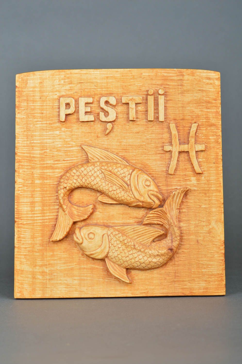 Unusual beautiful handmade varnished wooden wall panel with art carving Pisces photo 2