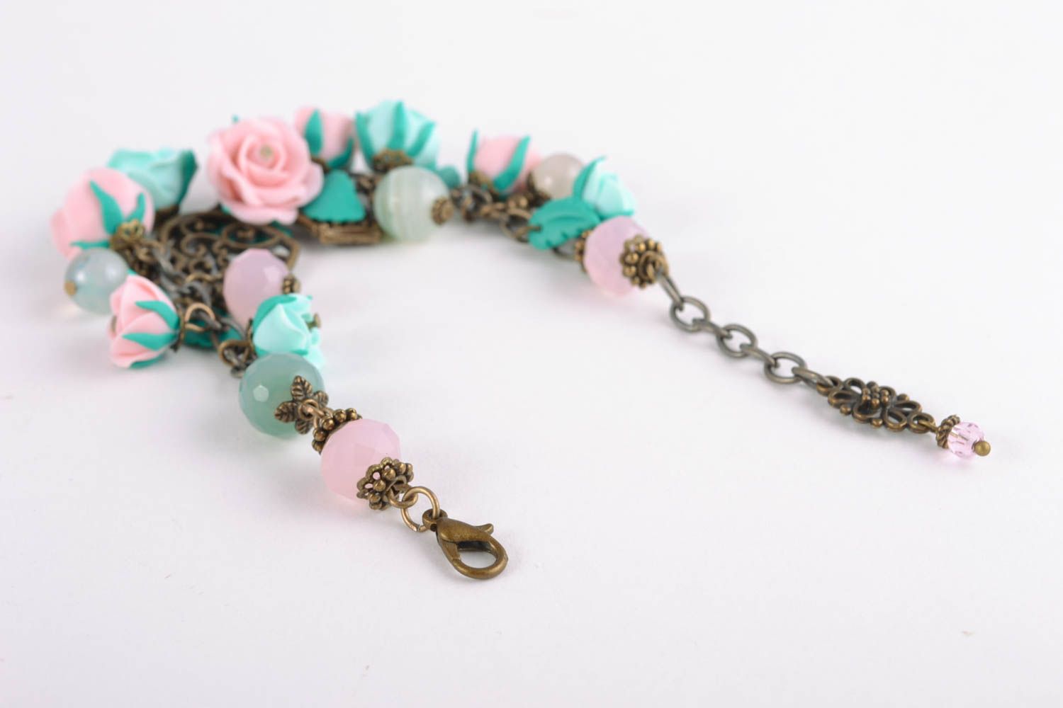 Charm bracelet with pink and turquoise roses and bronze charms photo 6