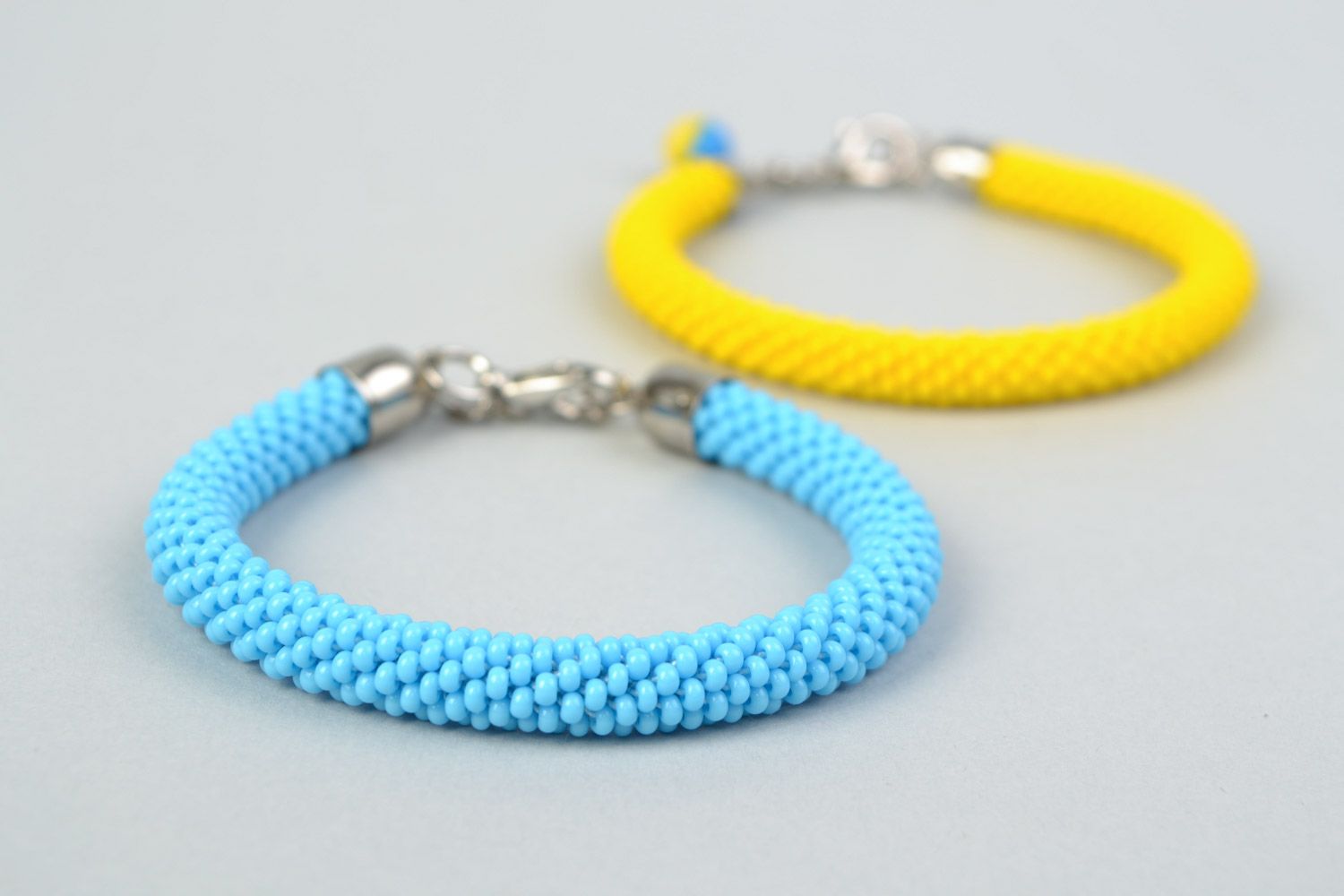 Set of 2 handmade beaded cord wrist bracelets of yellow and blue colors  photo 4
