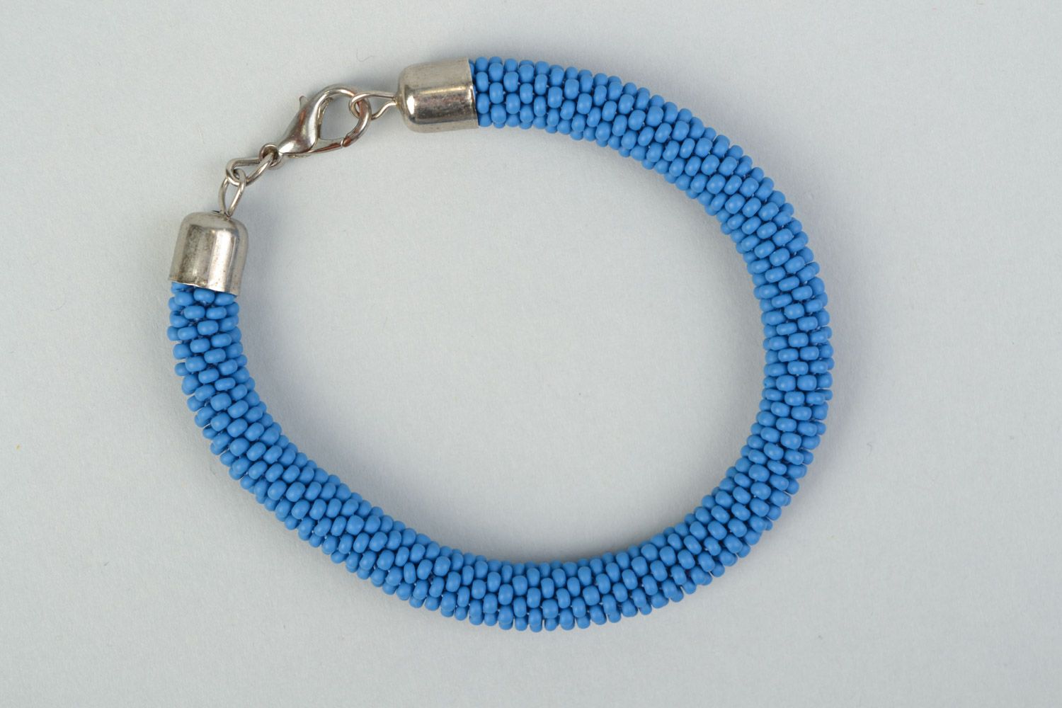 Handmade bright laconic beaded cord wrist bracelet of sky blue color for girl photo 2