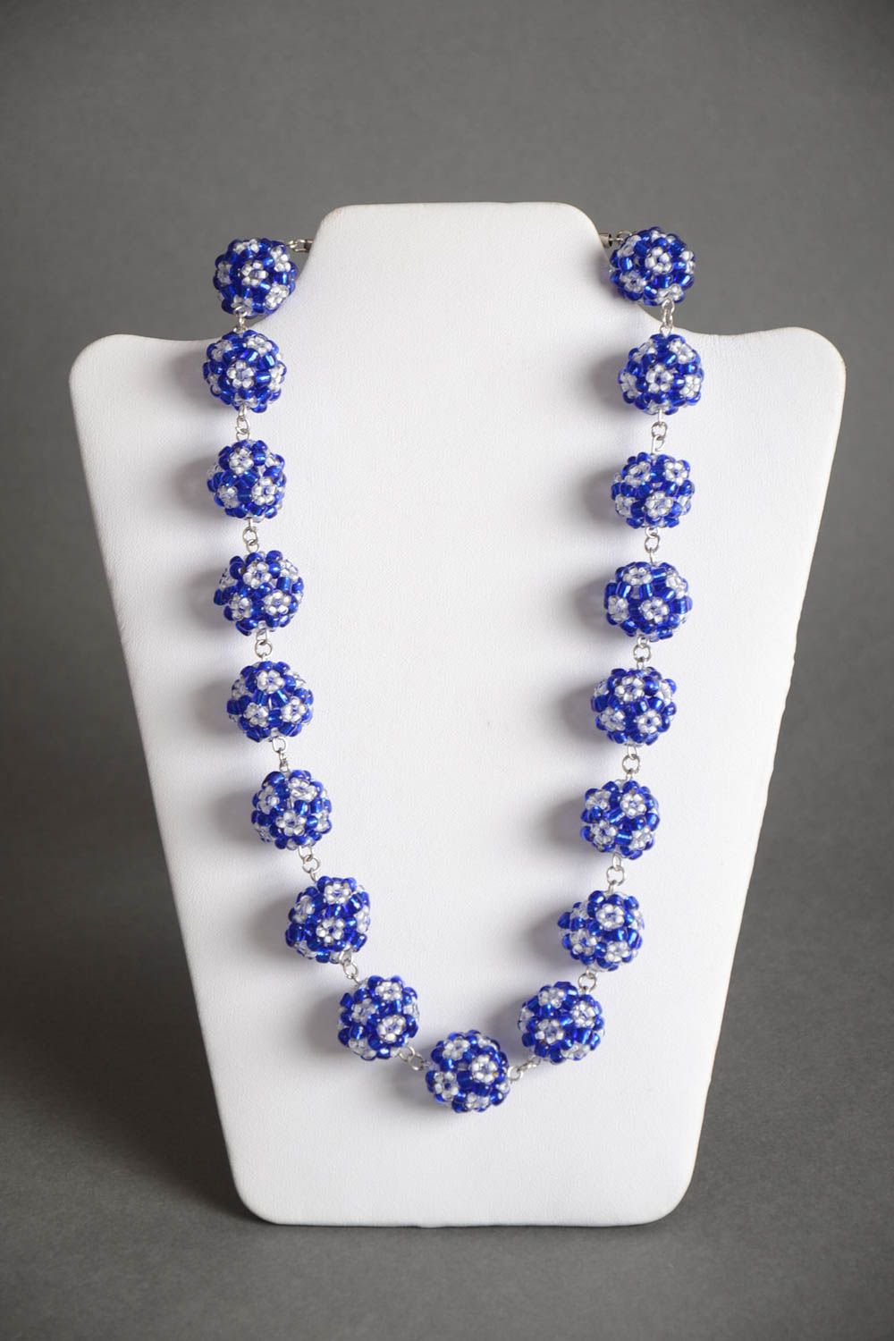 Handmade designer women's necklace with balls crocheted of blue and white beads photo 2