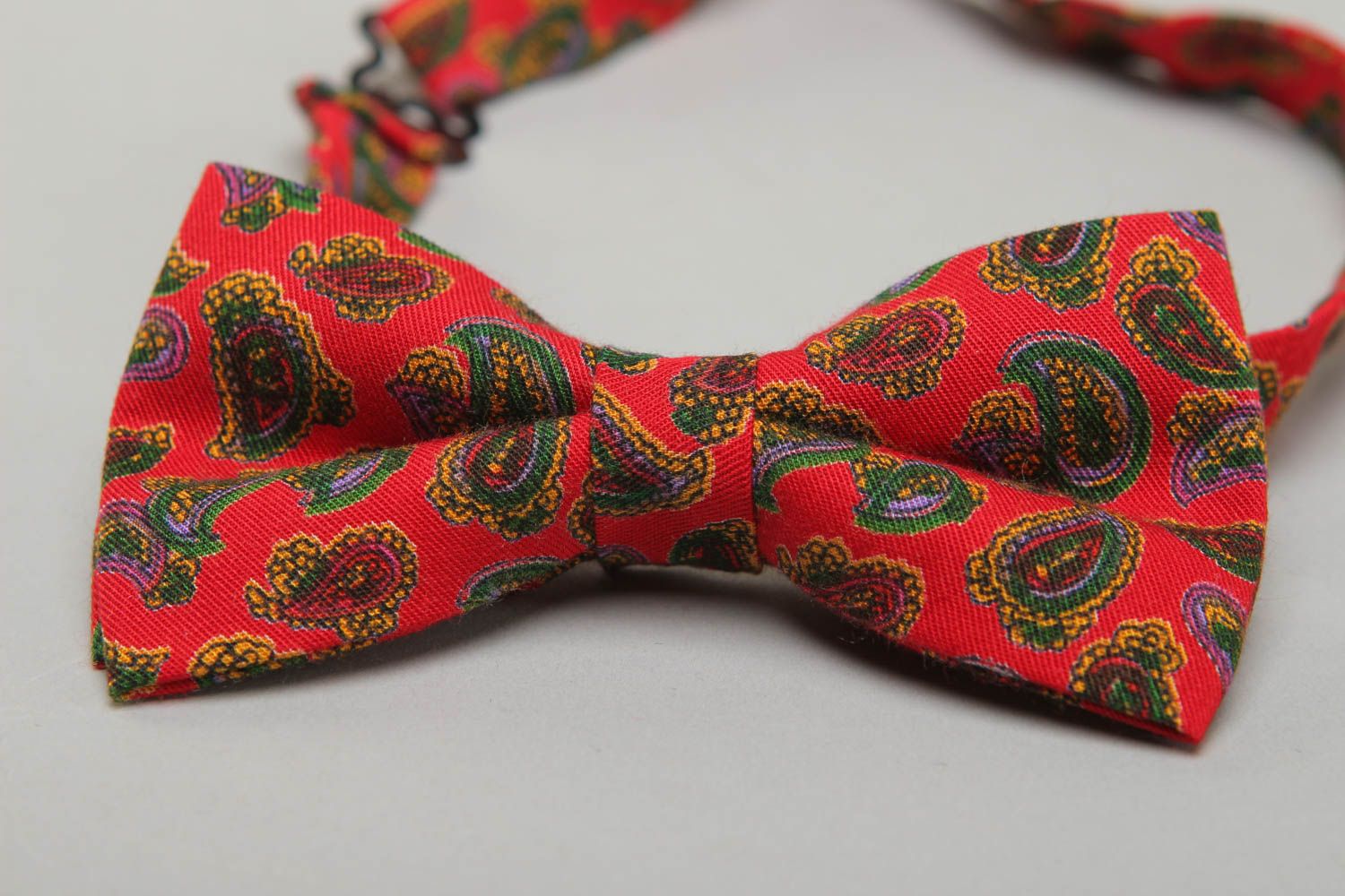 Red fabric bow tie with ornament photo 2
