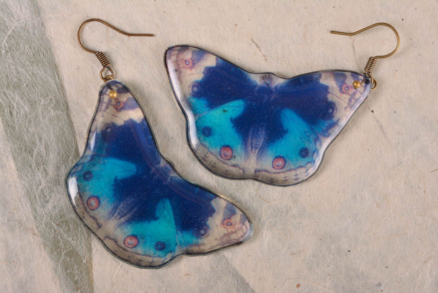 Bright summer handmade earrings of epoxy resin with blue butterflies photo 1