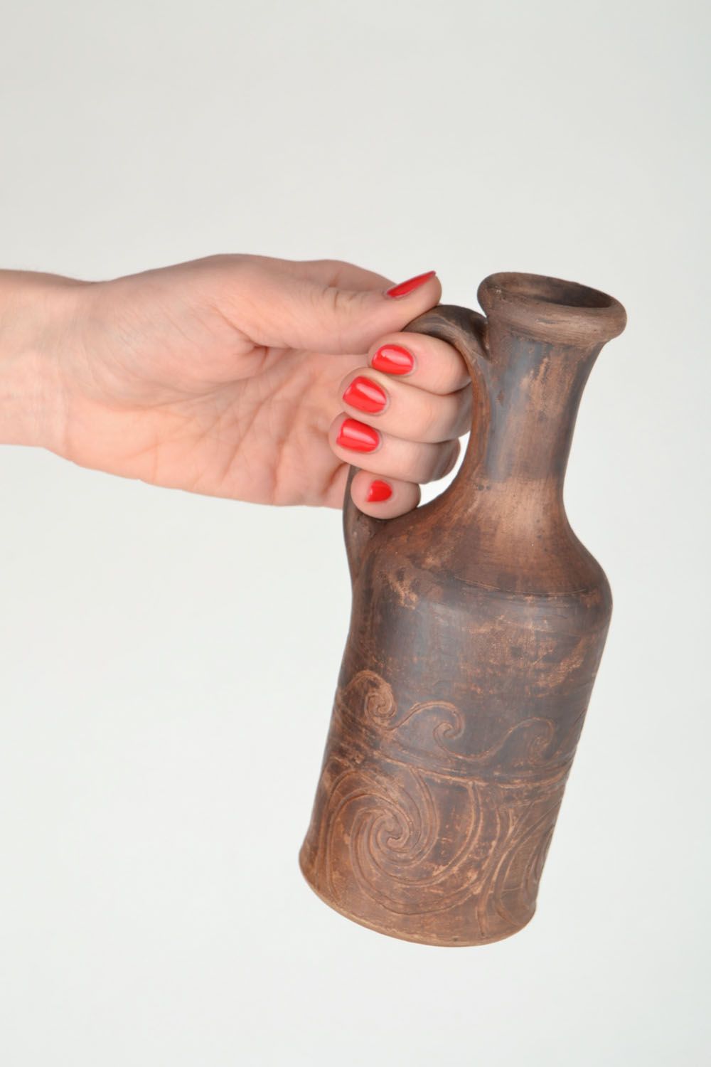 Garrafa de cerâmica com alça feita à mão  foto 2