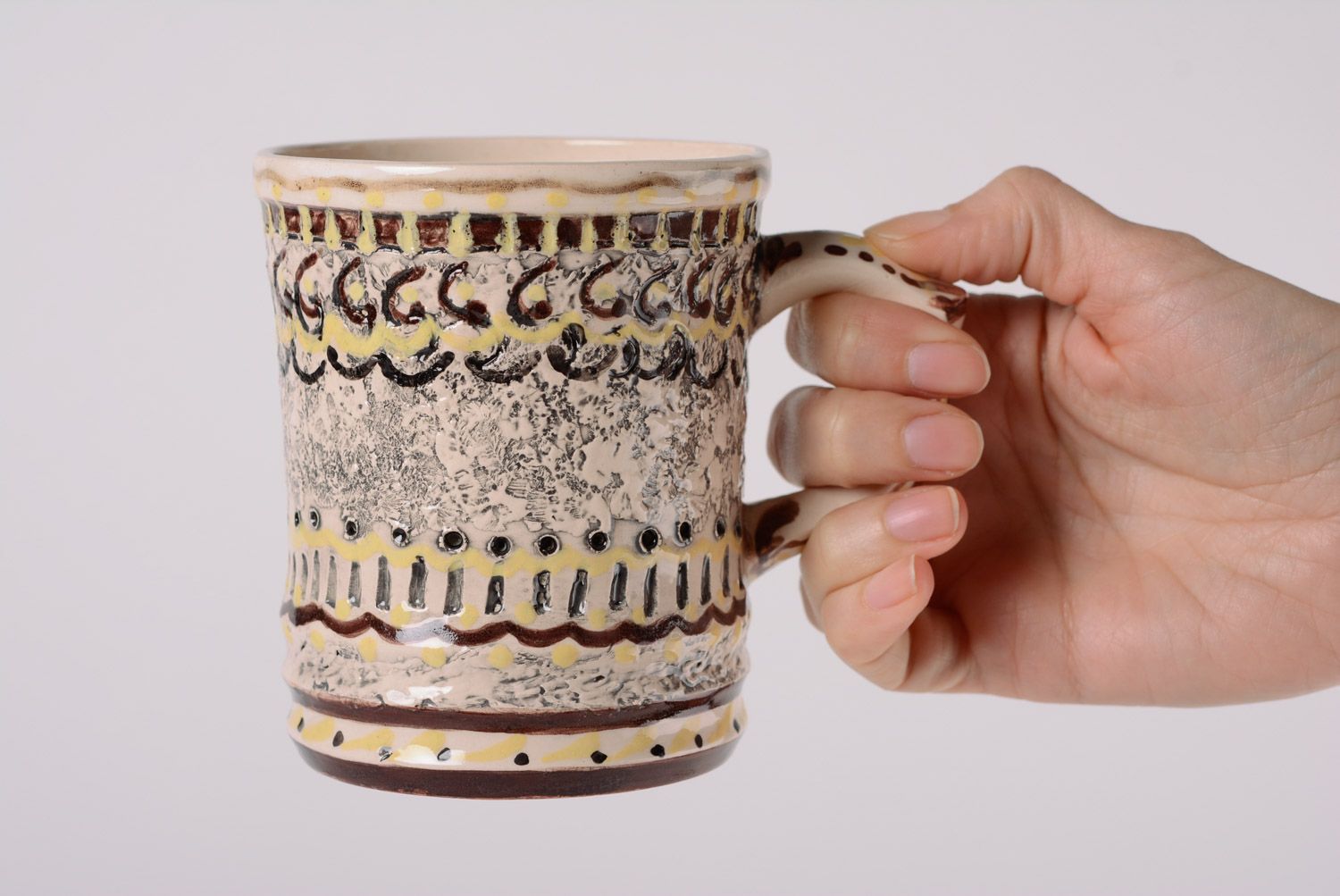 Handmade ceramic drinking mug for coffee and tea in yellow and brown color photo 5