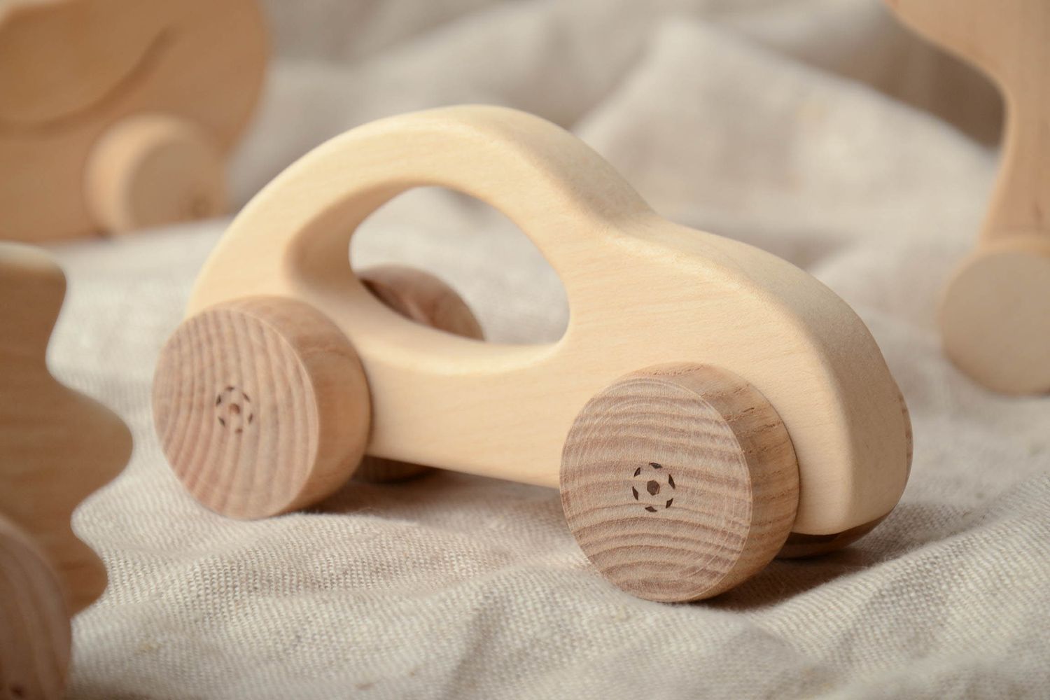 Wooden wheeled toy car photo 1