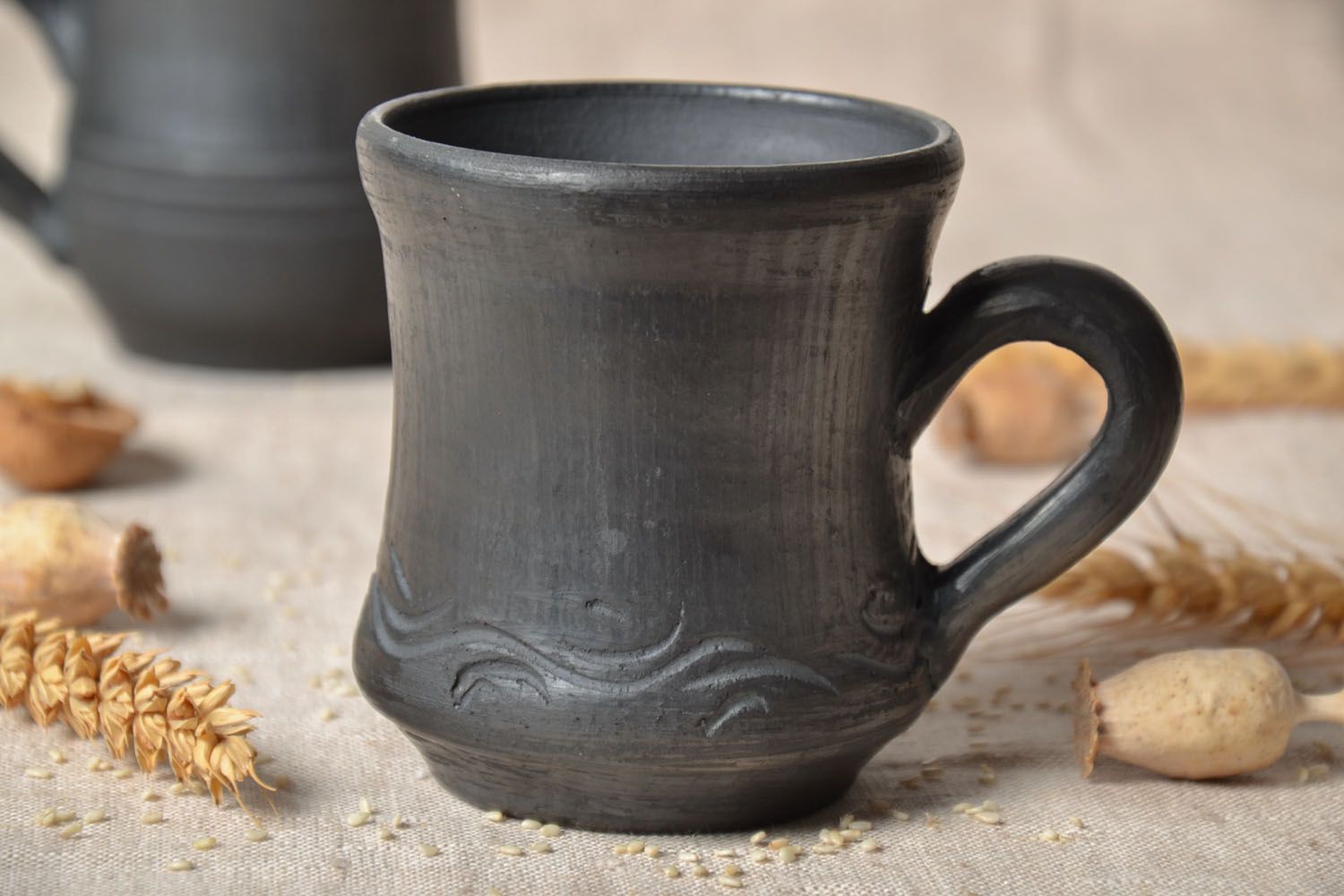 Black-smoked ceramic cup in rustic style with handle and no pattern photo 1