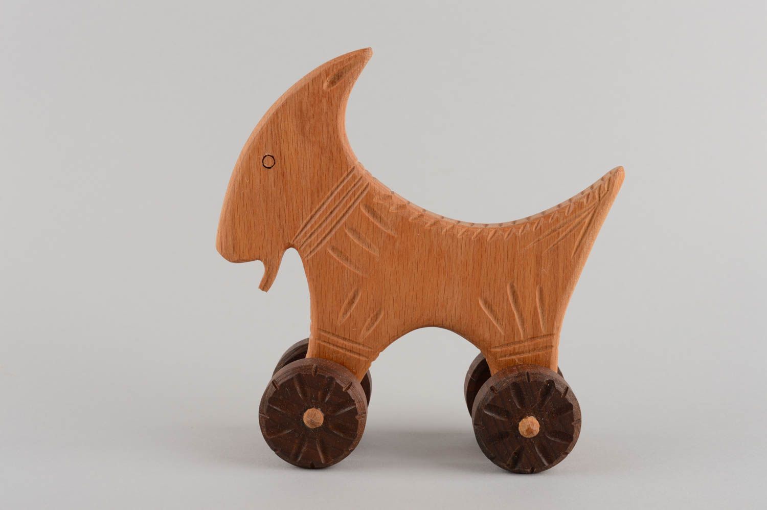 Eco friendly handmade wooden wheeled toy goat for children photo 3