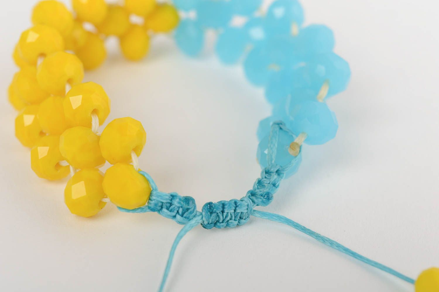 Handmade beautiful blue and yellow bracelet made of crystal macrame technique photo 3