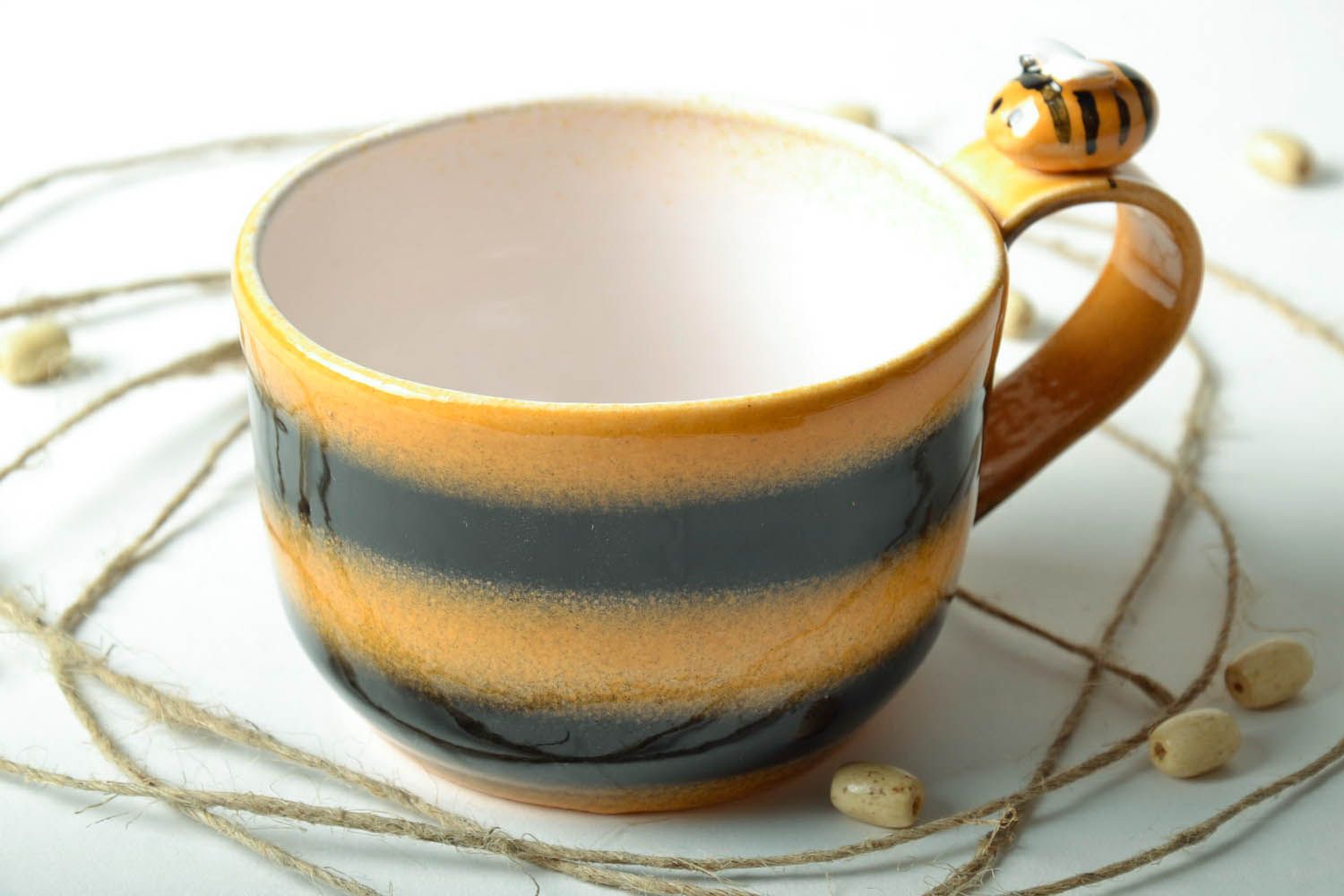 Porcelain art drinking cup in bumblebee colors with handle photo 1