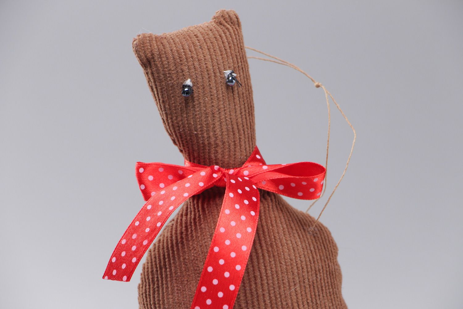 Small handmade soft toy sewn of velvet with eyelet Brown Cat with red bow photo 2