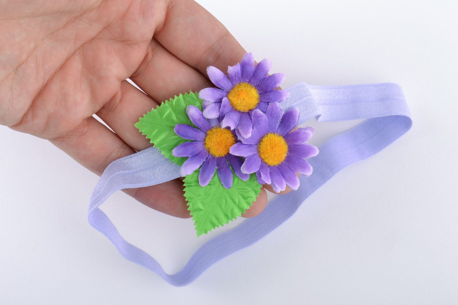 Handmade child's stretch headband with floral composition in lilac color palette photo 2