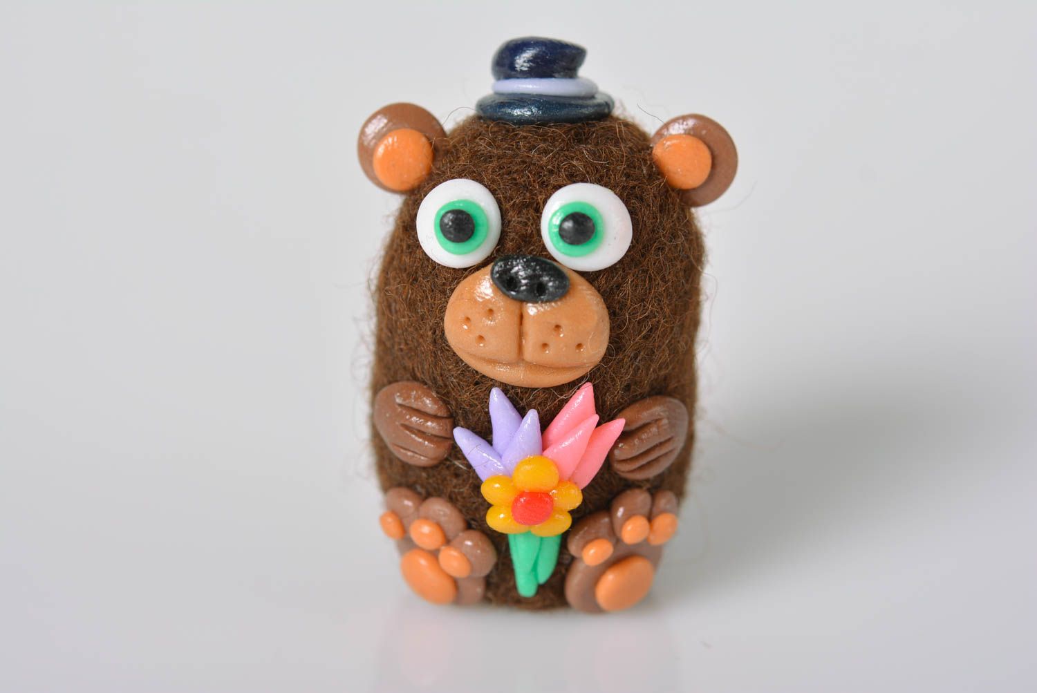 Unusual interior toy stylish beautiful statuette cute bear with flower photo 1