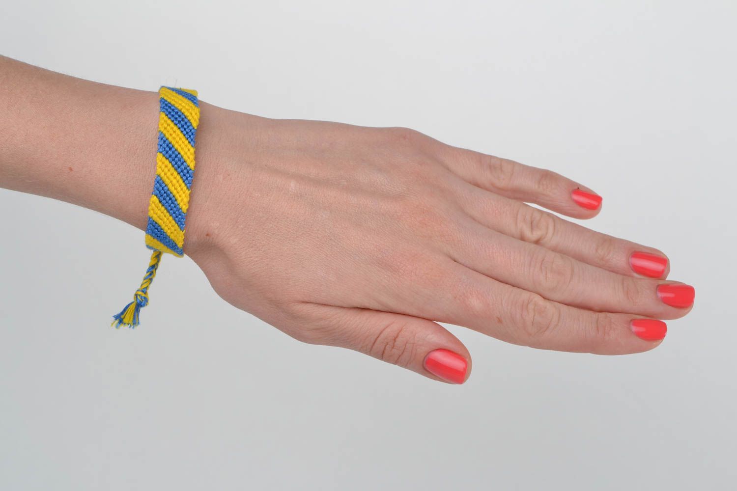 Handmade designer yellow and blue wrist bracelet woven using macrame technique photo 2