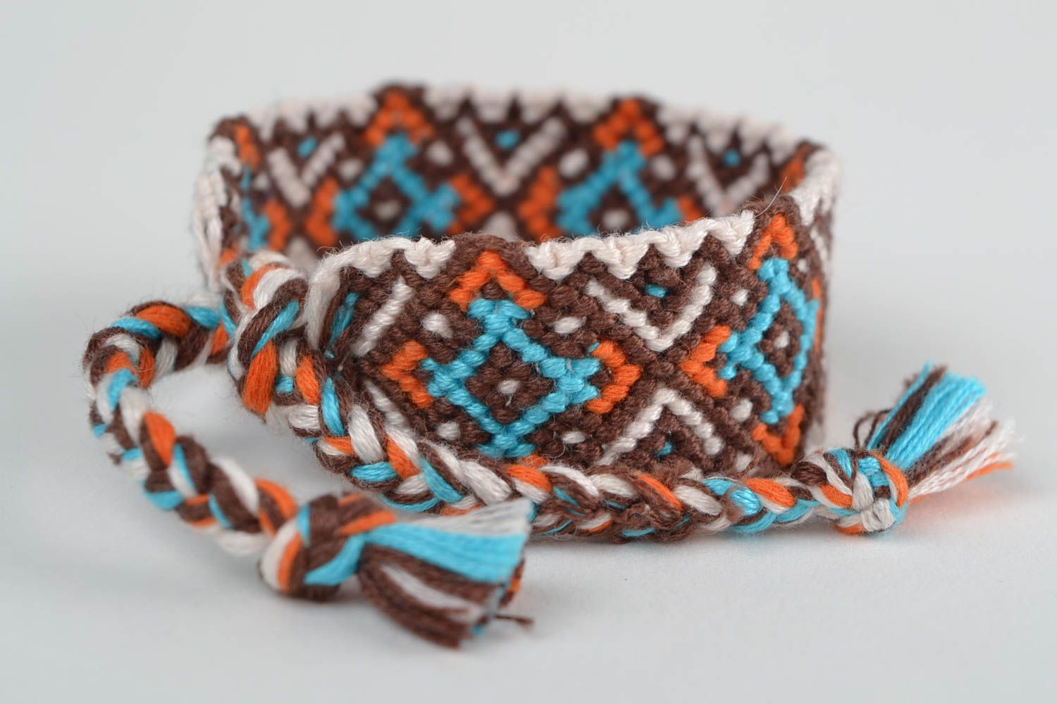 Handmade designer friendship wrist bracelet with ethnic ornament brown and blue photo 4