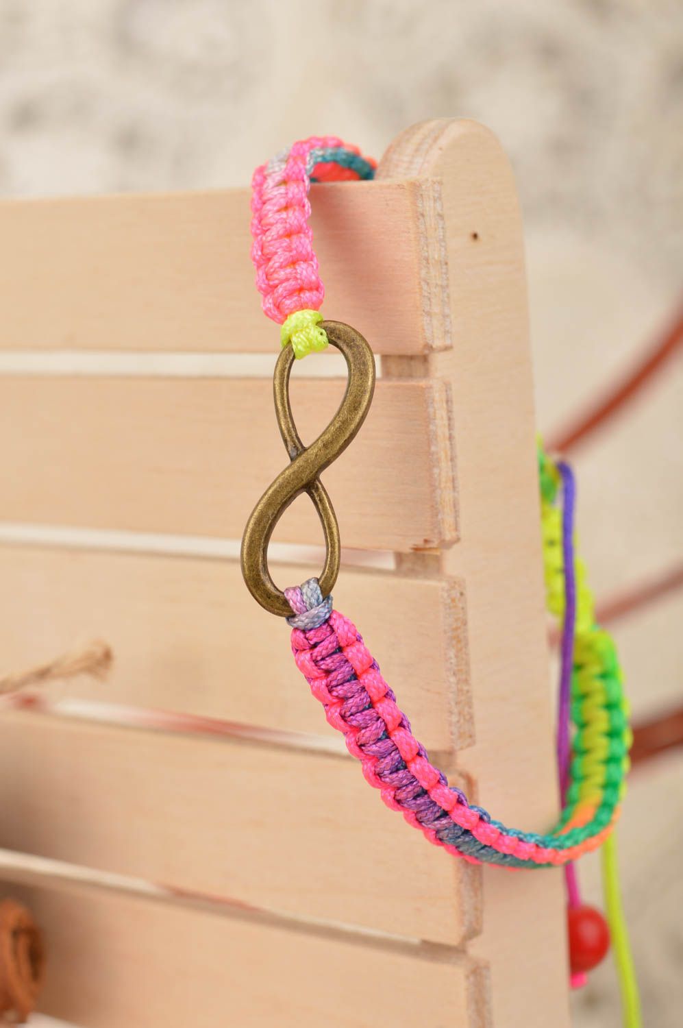 Handmade cute thin colorful woven wrist bracelet made of silk with insert photo 1