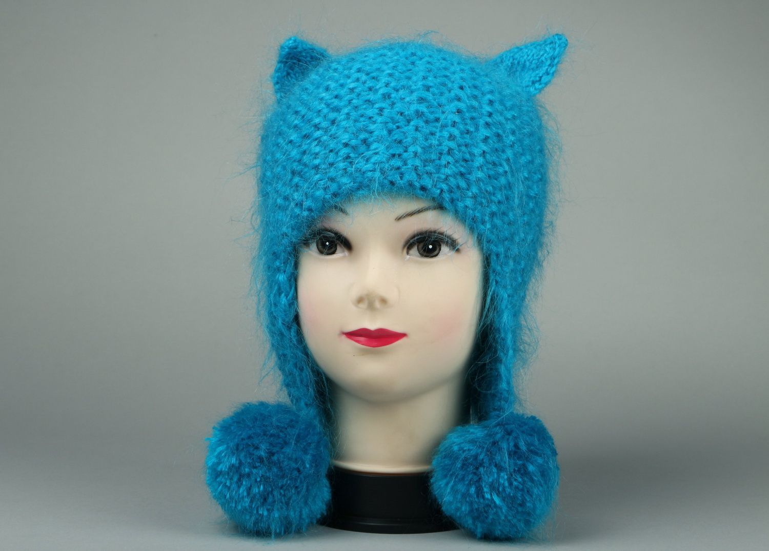 Blue knitted hat with pom-poms photo 2