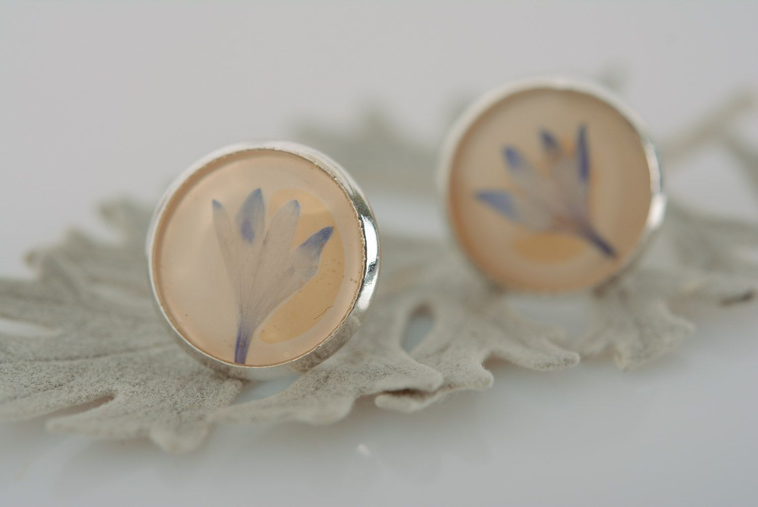 Handmade round stud earrings with natural blue flowers in epoxy resin  photo 1