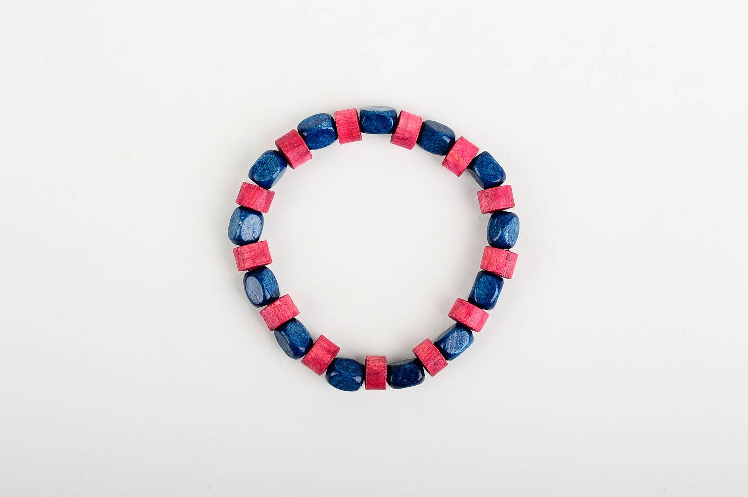 Stylish striped handmade beaded wooden bracelet wooden in red and blue color photo 1