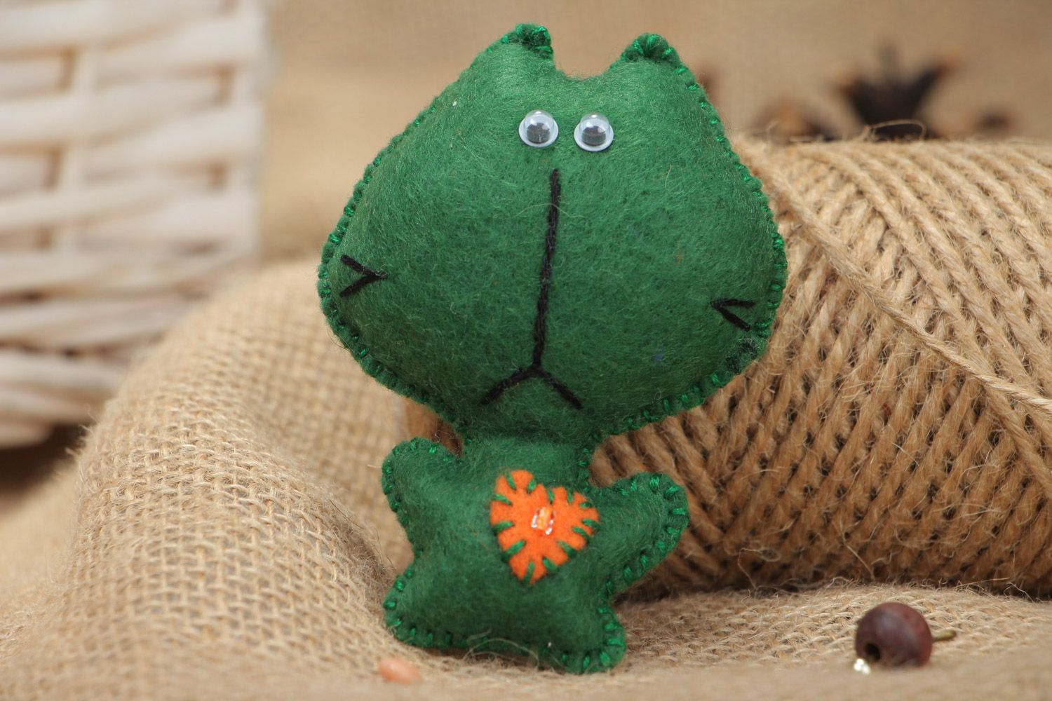 Small handmade soft toy sewn of felt funny green kitten with applique work photo 1