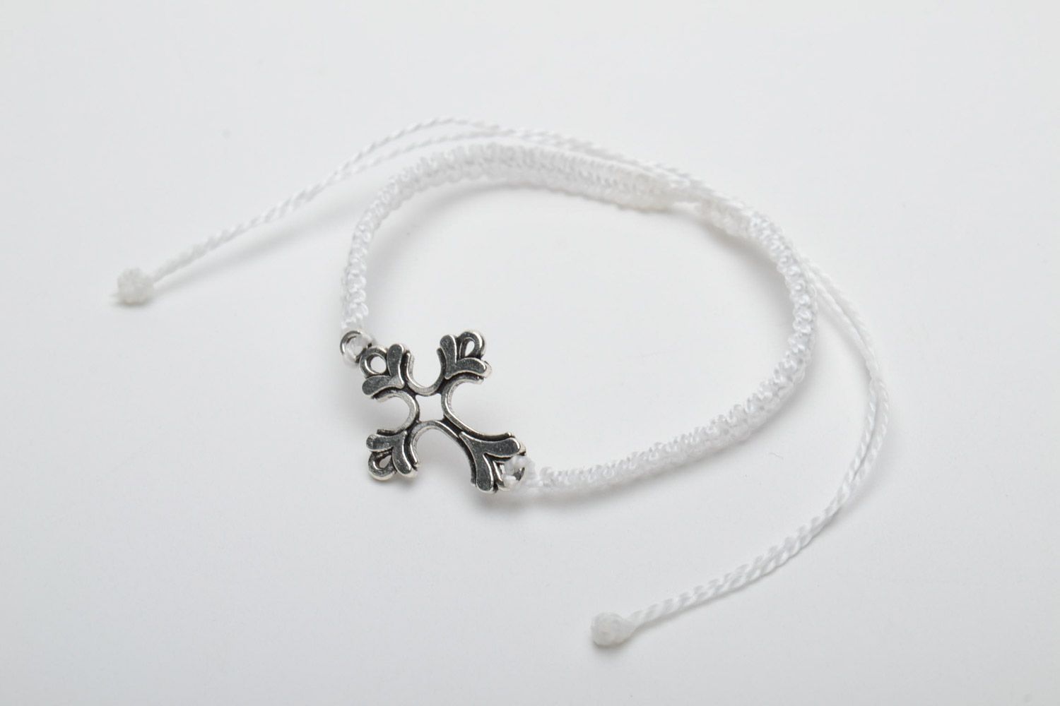 Handmade white woven thread bracelet with metal cross photo 3