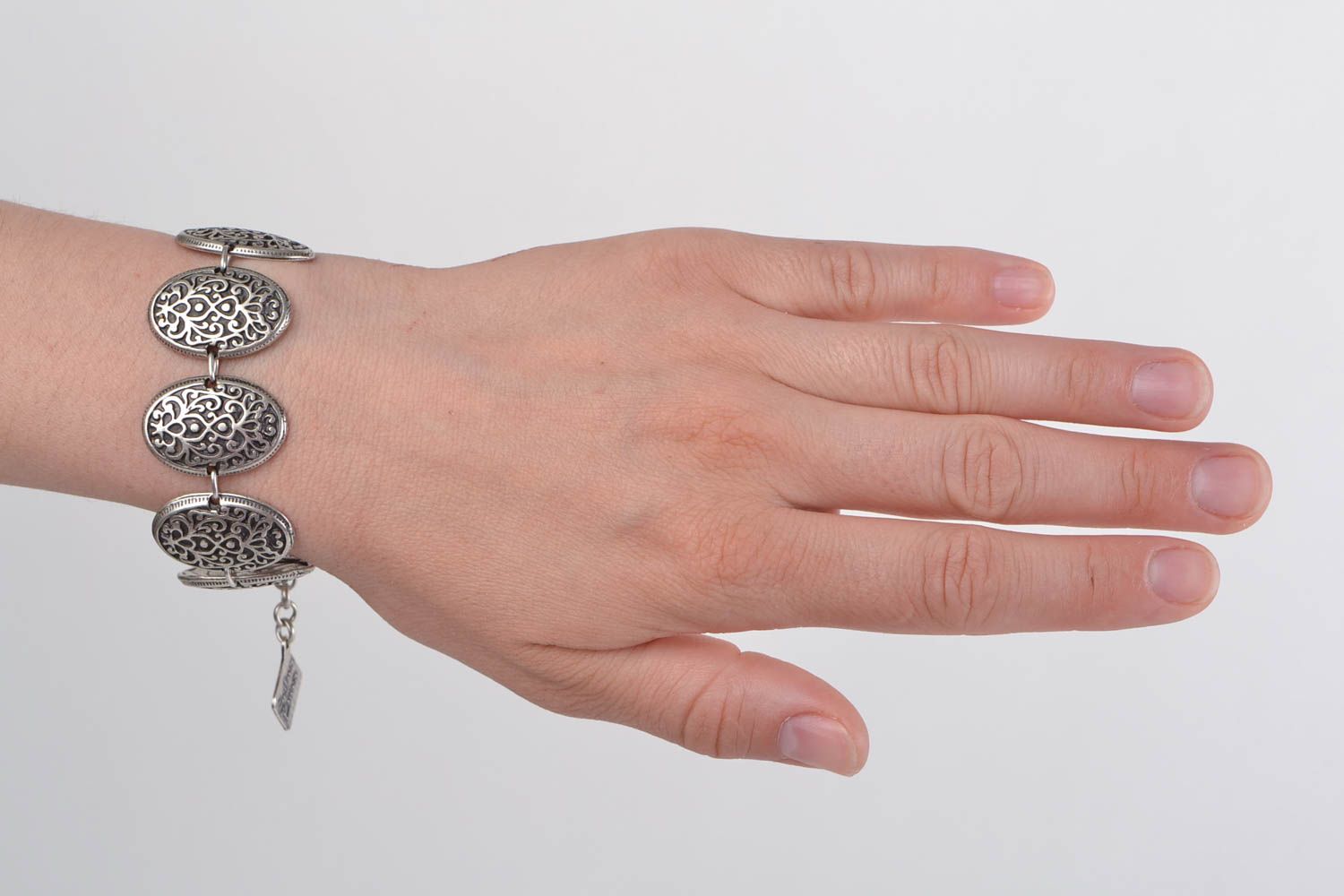Handmade designer wrist bracelet cast of metal alloy in special molds for women photo 1