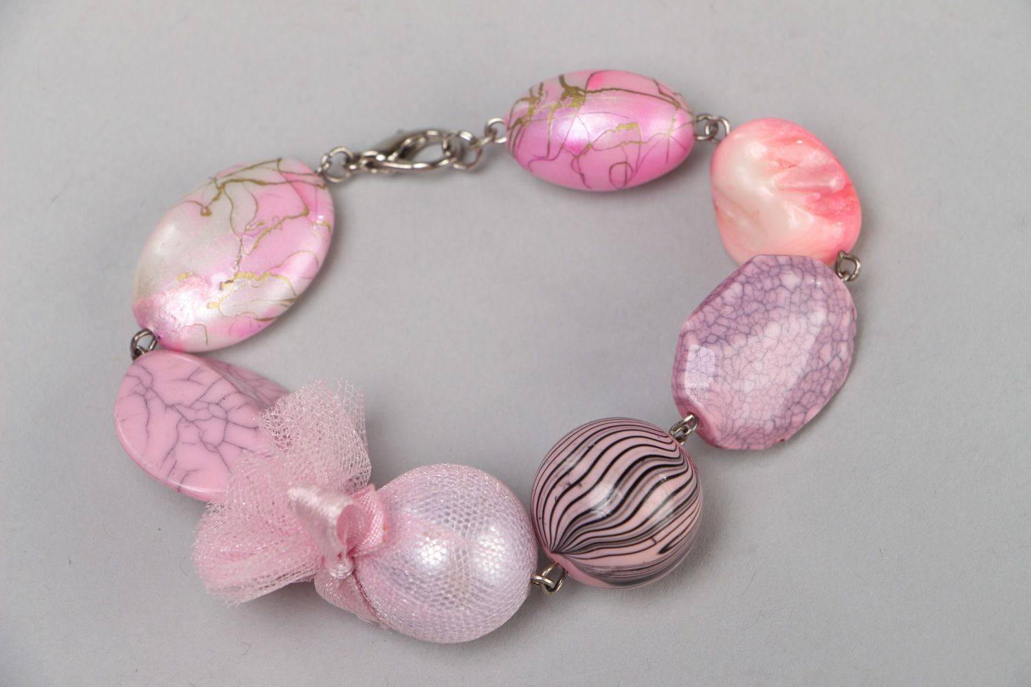 Massive handmade wrist bracelet with light pink plastic beads and metal lock photo 2