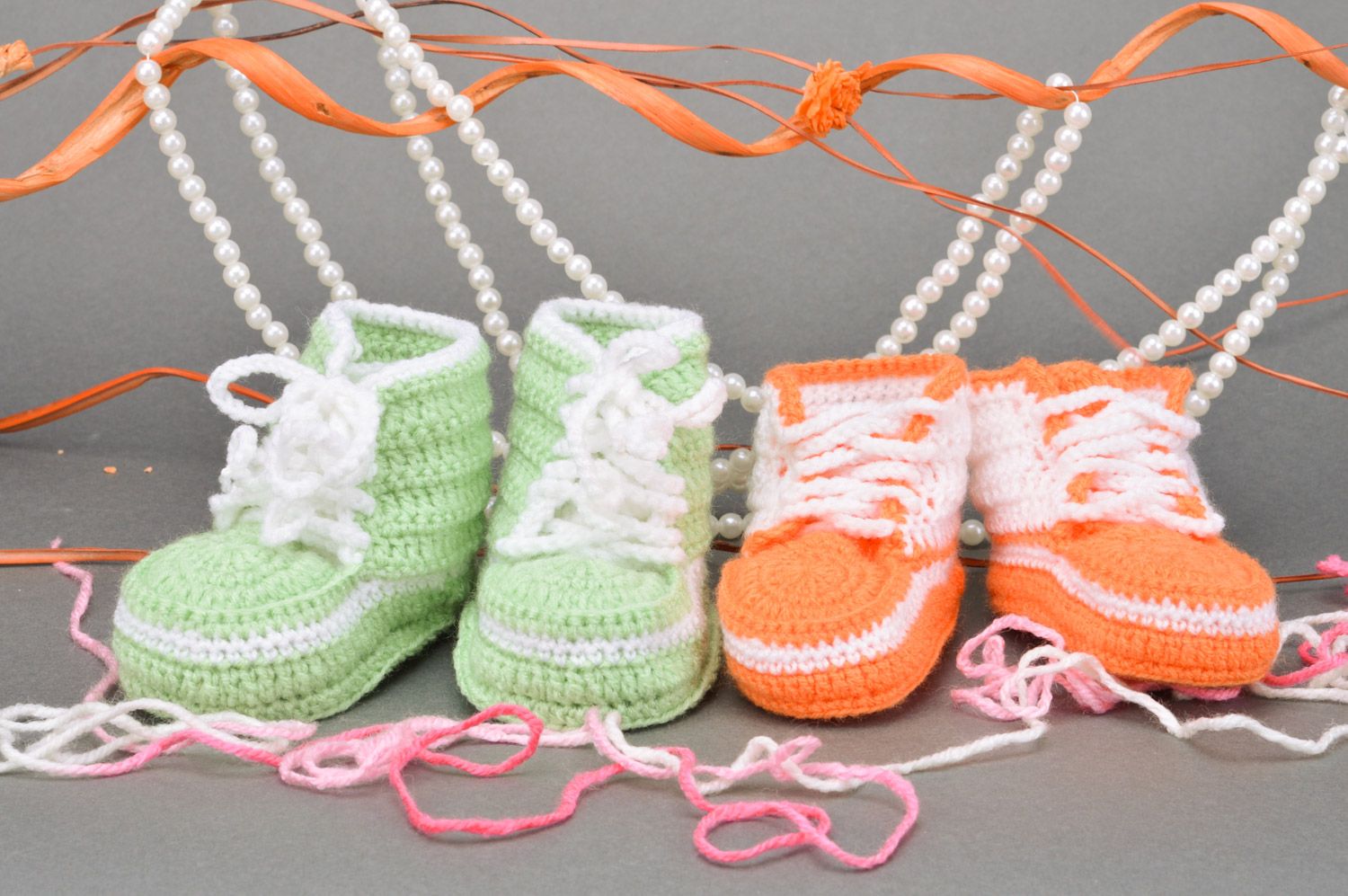 A set of handmade crocheted baby booties two pairs of light green and orange colors photo 1