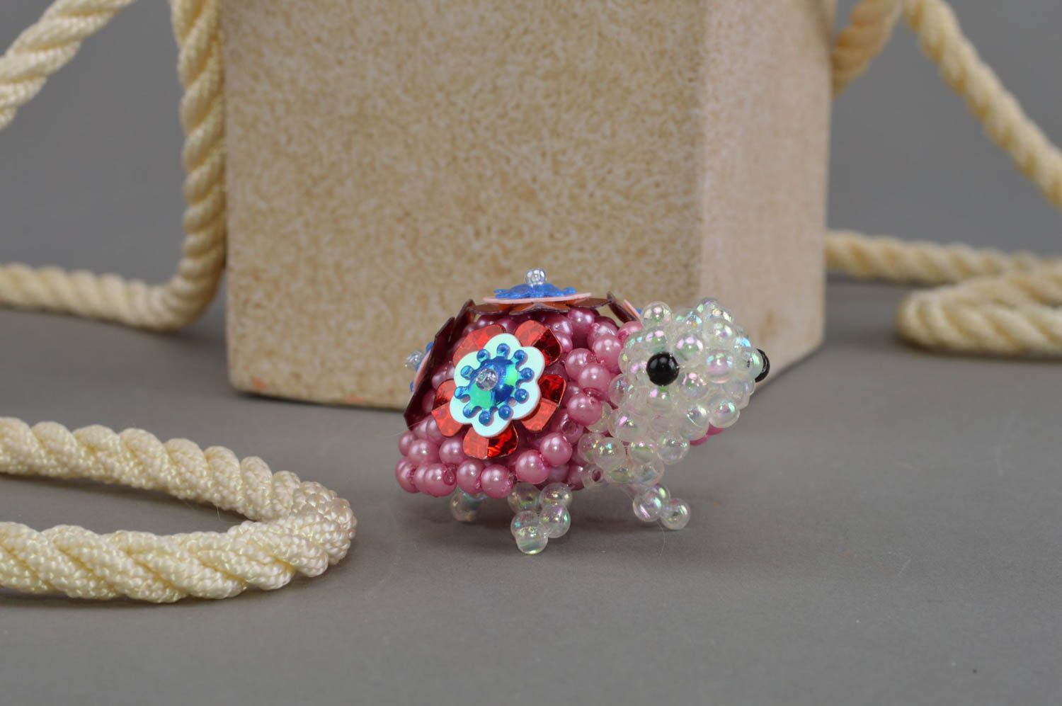 Handmade small animal figurine woven of beads statuette of turtle white and pink photo 1