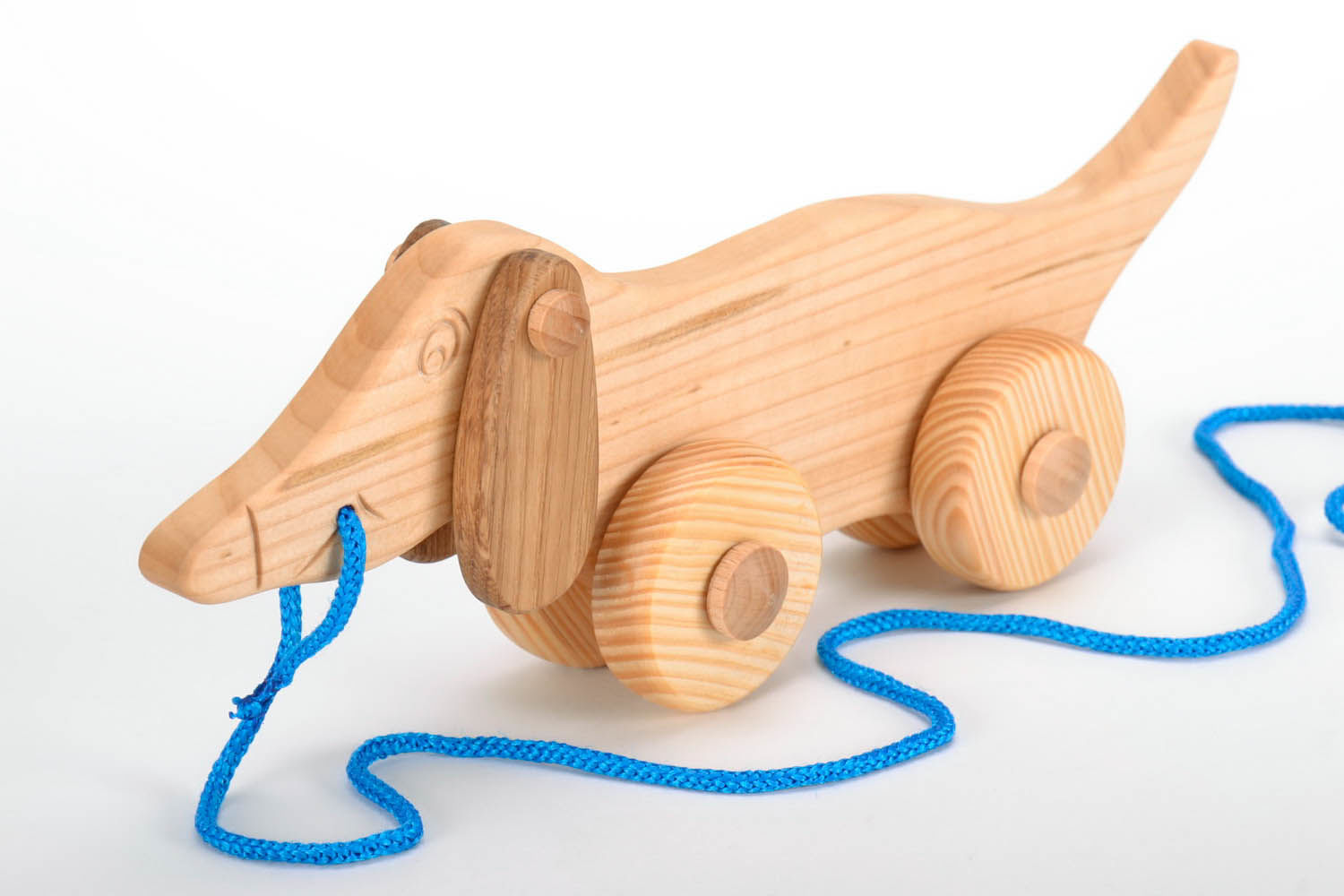 Toy on wheels Dachshund made of wood photo 3