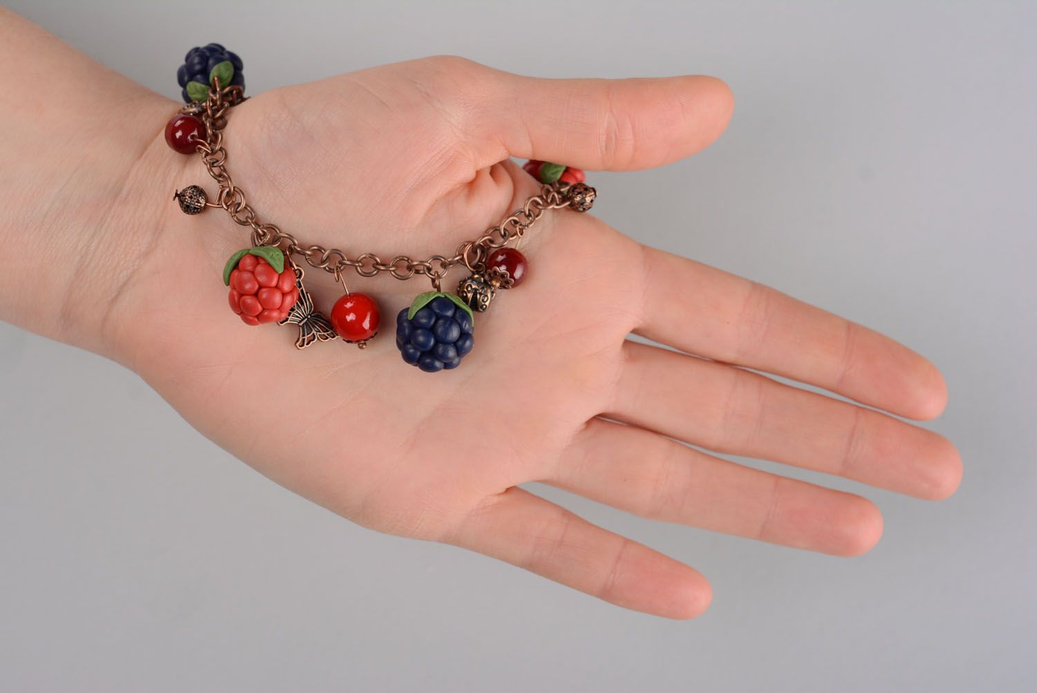 Plastic bracelet with charms in the shape of berries photo 5
