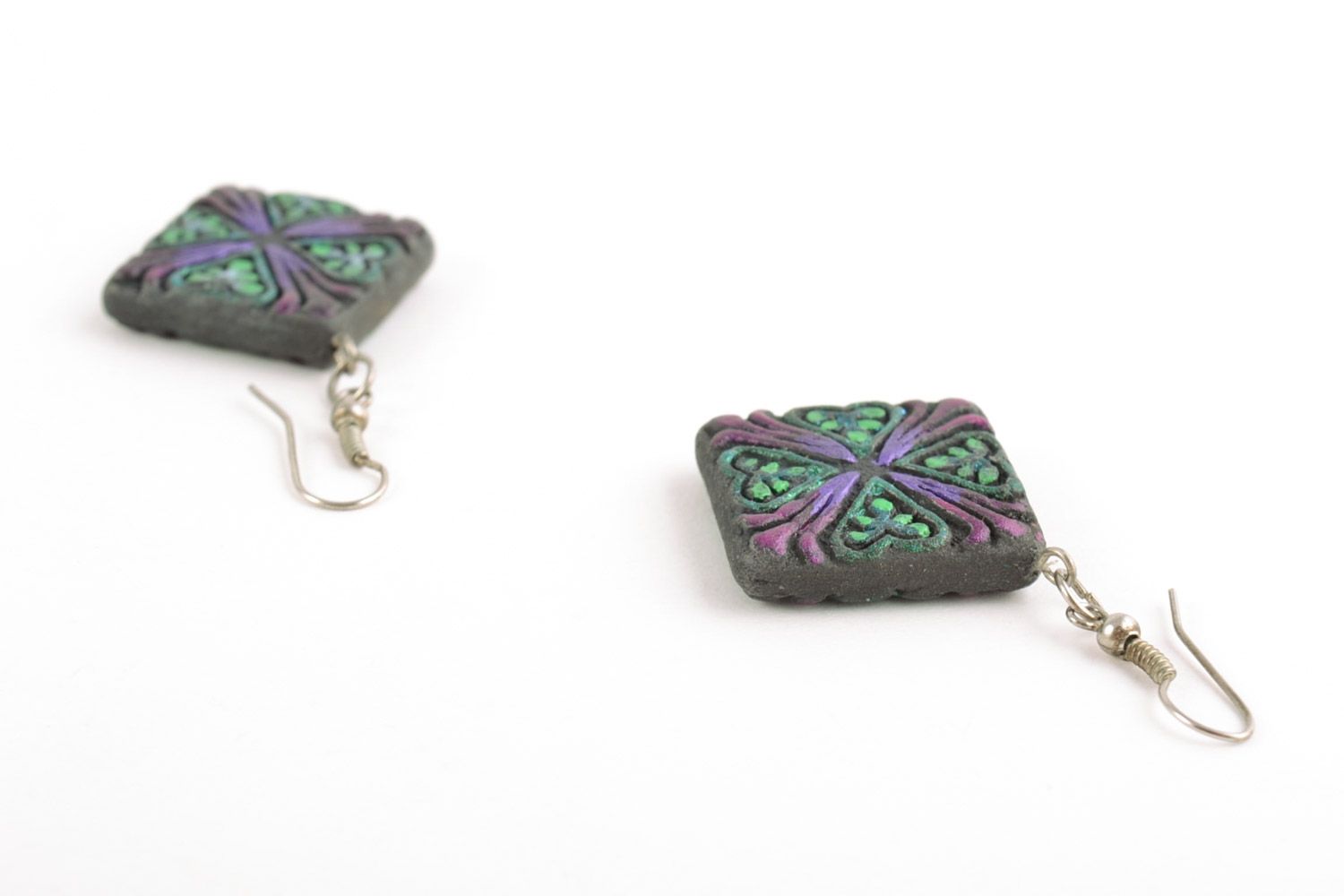 Handmade ceramic rhombus-shaped dangling earrings of black color with ornament photo 4