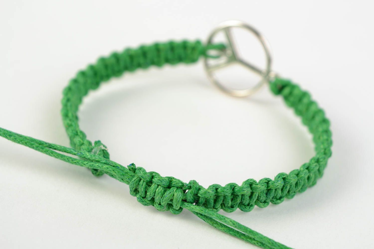 Green handmade woven cotton cord wrist bracelet with metal charm photo 4