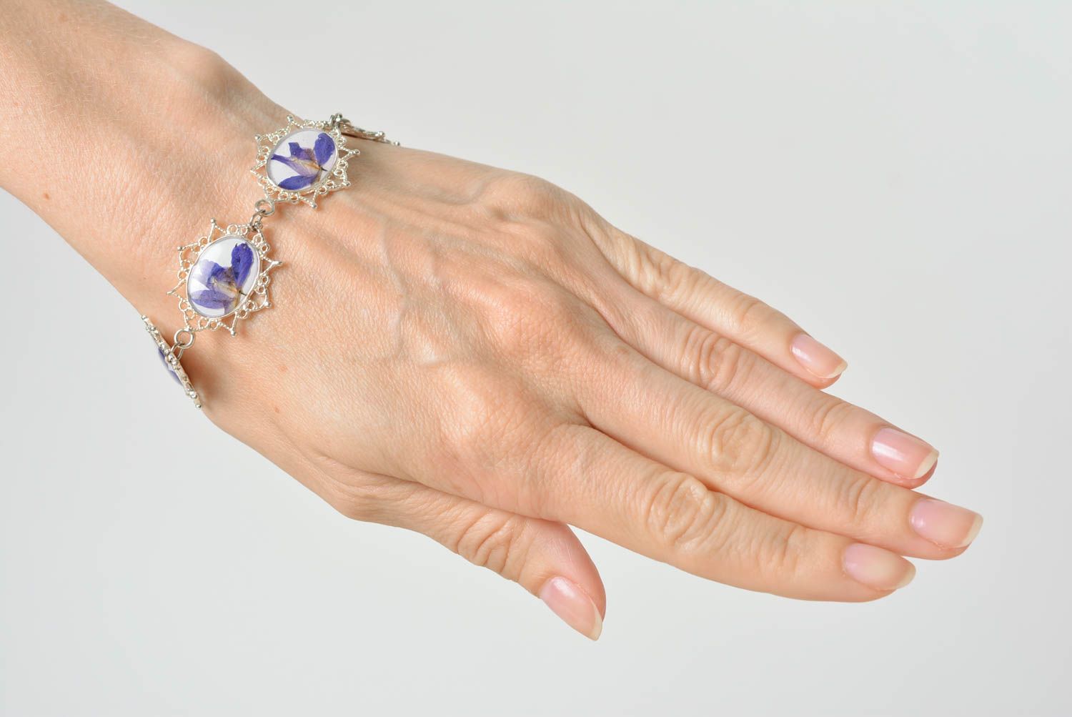 Beautiful handmade women's wrist bracelet with real flowers coated with epoxy photo 3