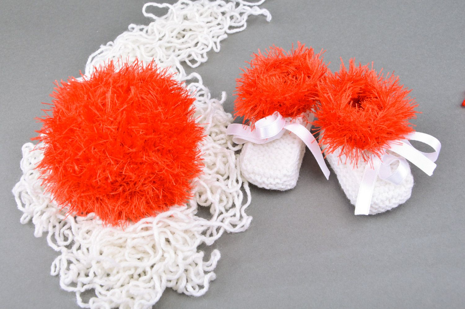 Handmade crochet soft toy ball and knitted baby booties in red and white colors photo 1