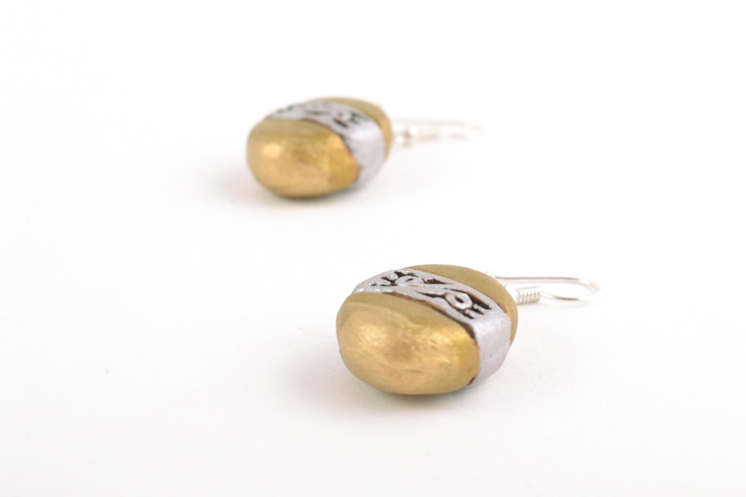 Unusual handmade ceramic dangling earrings of oval shape and golden color photo 4