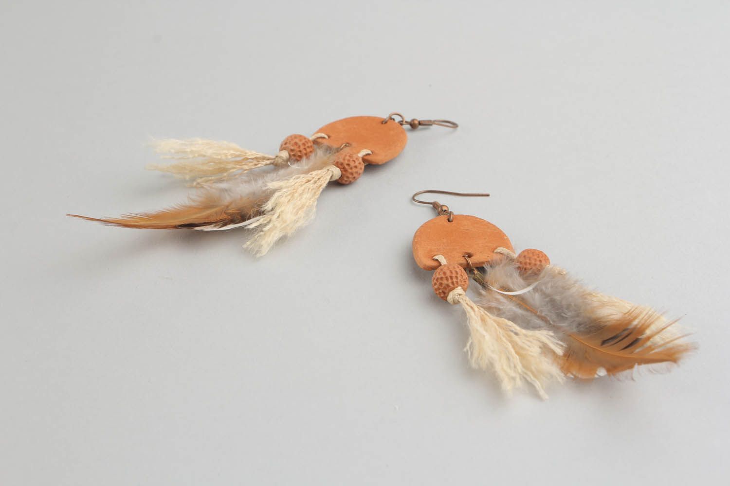 Long earrings with feathers photo 5