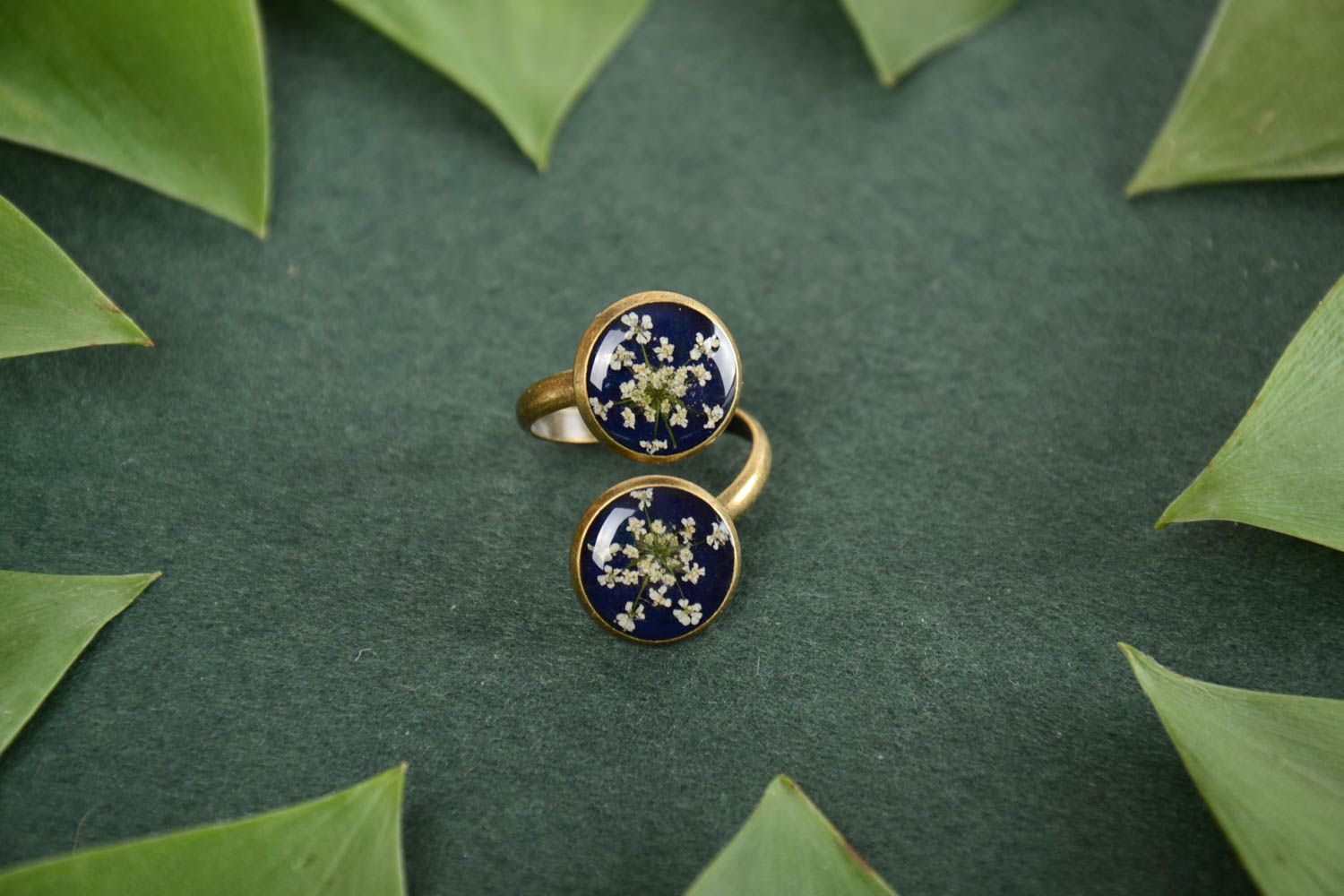 Handmade elegant dark blue metal jewelry ring with flowers in epoxy resin photo 1