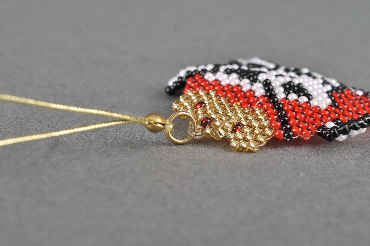 Braided keychain made of beads photo 1