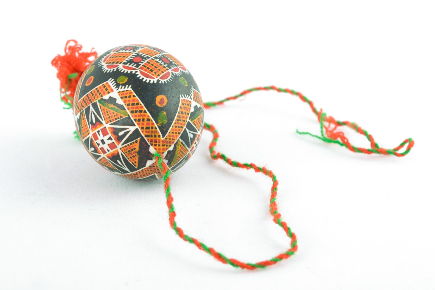 Handmade Easter egg painted with melted wax with tassels for home decoration photo 5