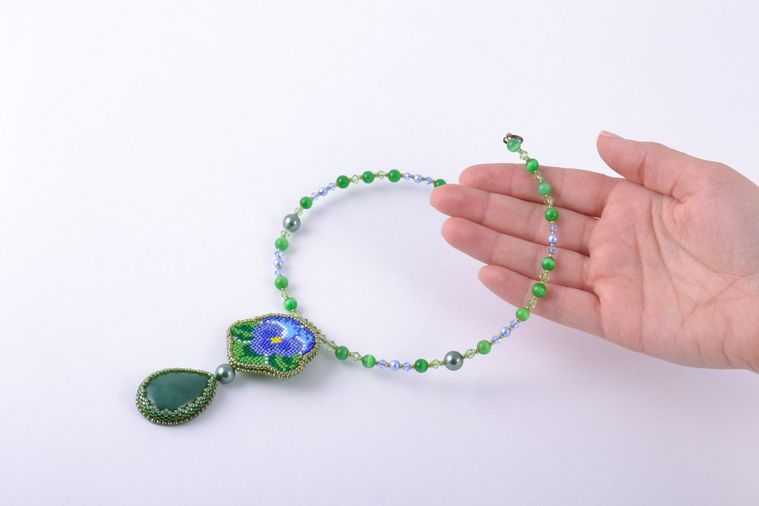 Handmade women's necklace embroidered with beads and natural stones with charm photo 2
