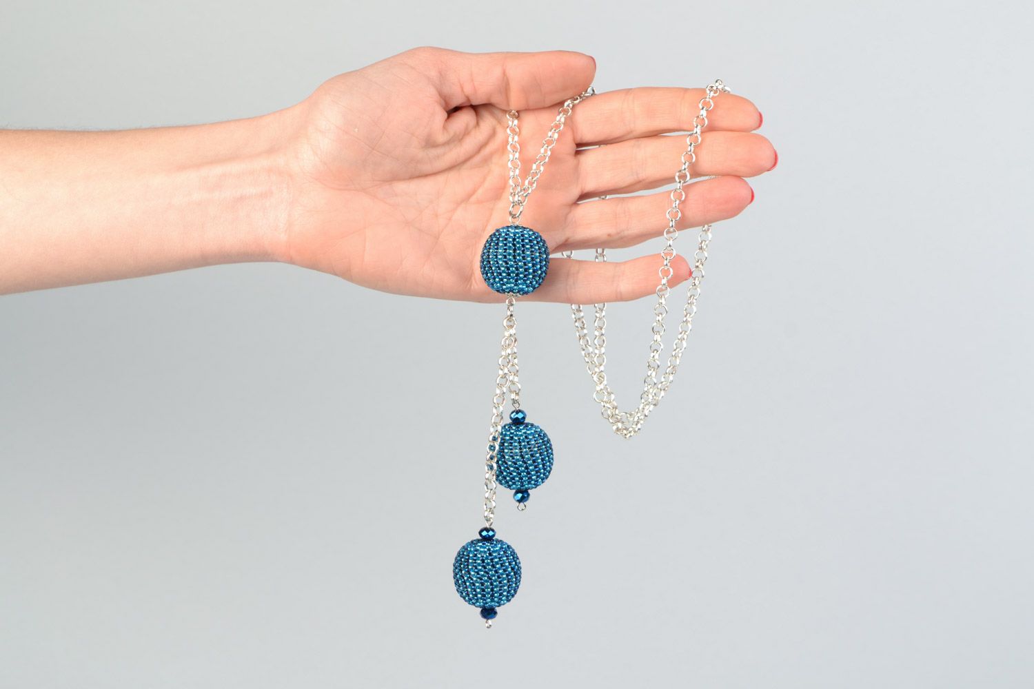 Laconic handmade pendant with blue beaded balls on long metal chain for women photo 2