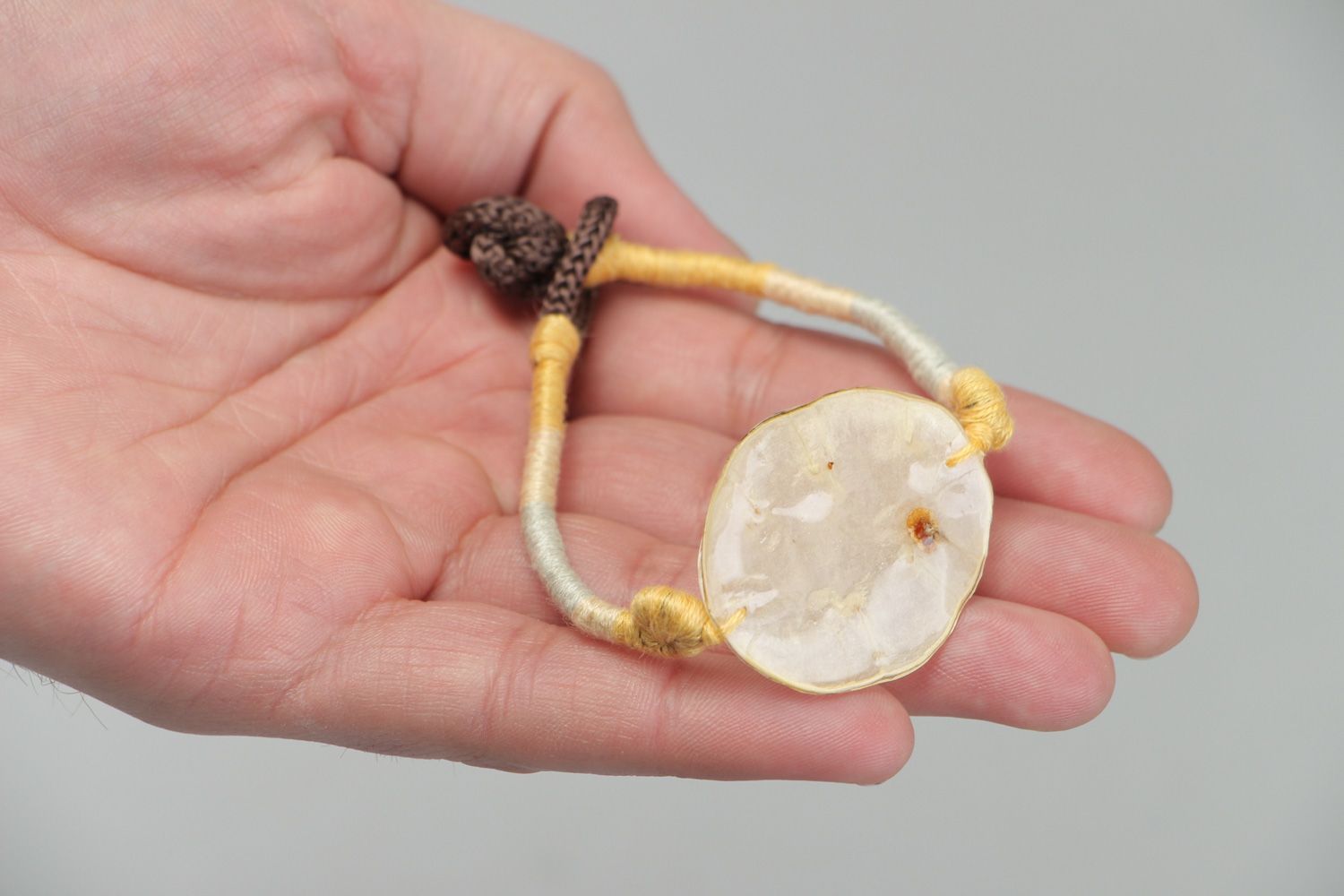 Handmade friendship bracelet with dried flowers coated with epoxy Lunaria photo 4