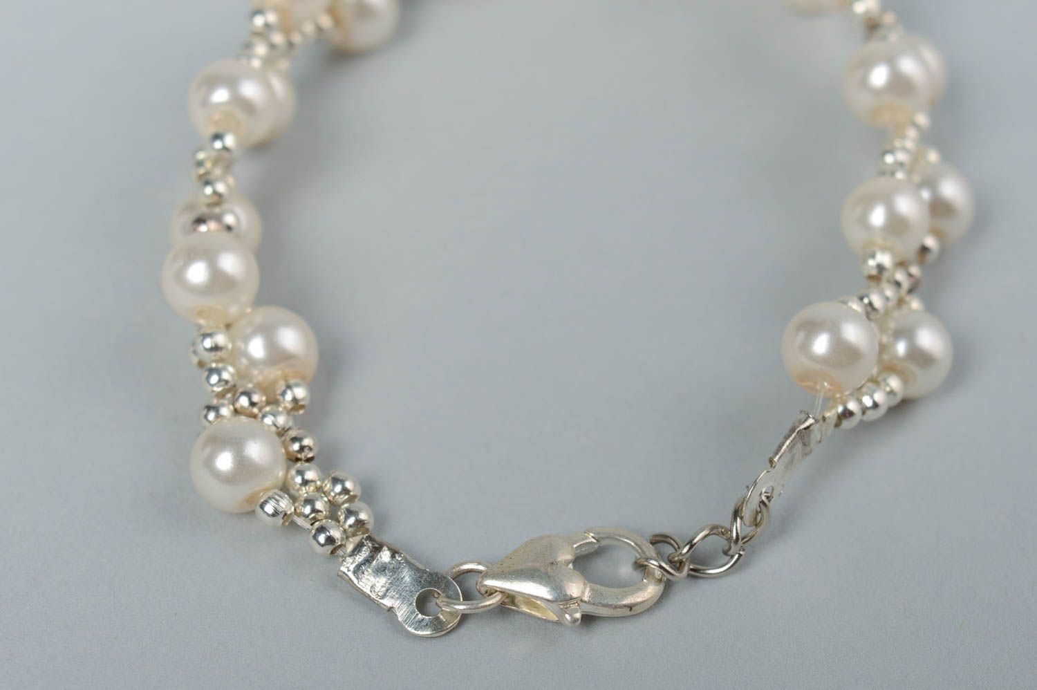 Stylish handmade designer artificial pearl beaded bracelet of white color photo 4