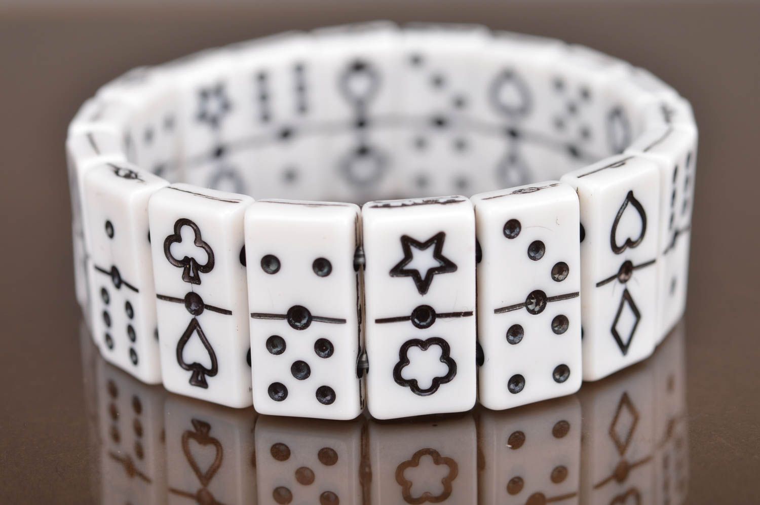 Black and white bracelet made of flat beads in shape of dominoes counters photo 2