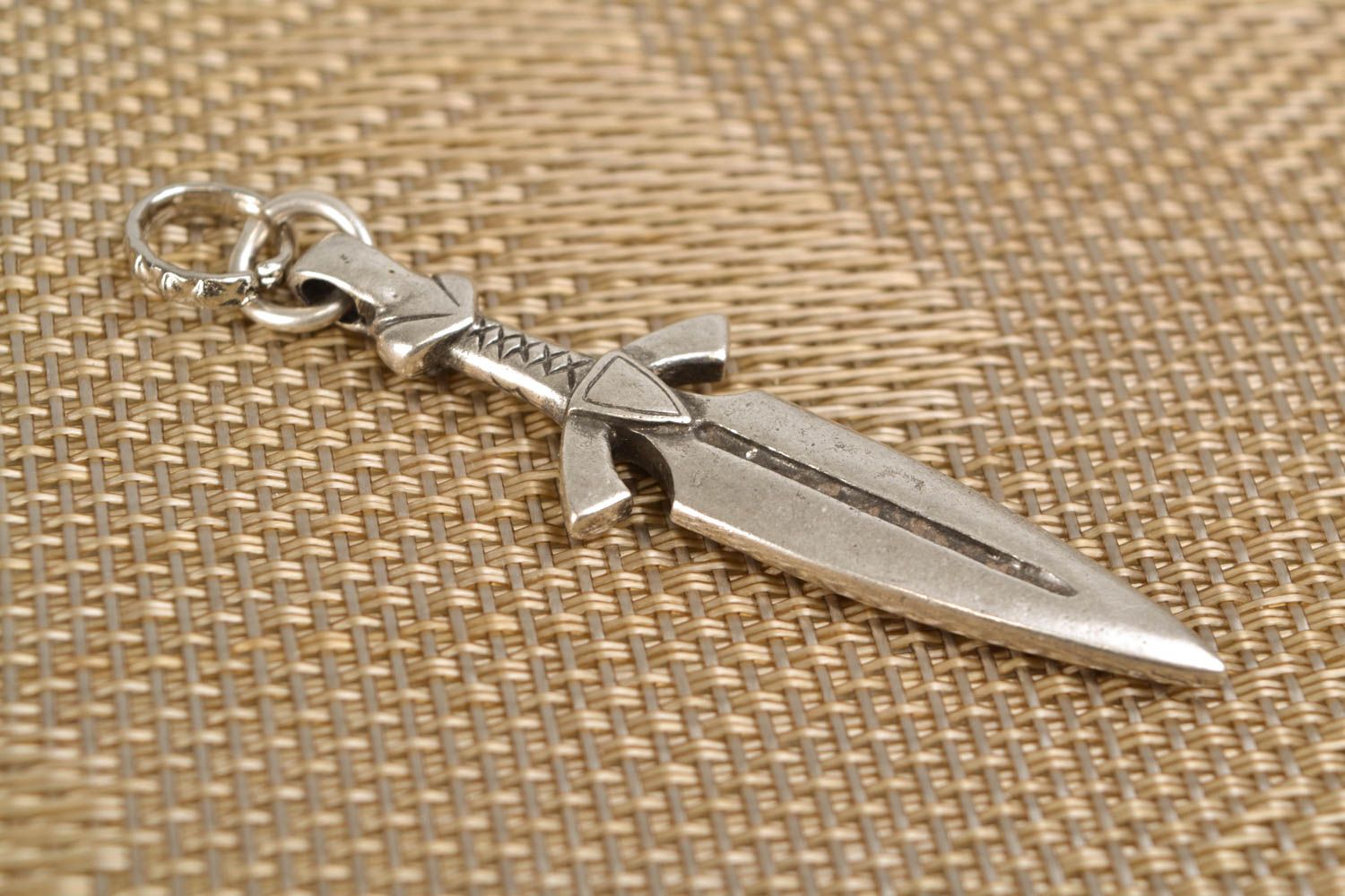 Metal pendant in the shape of sword photo 1